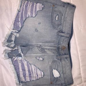 Light blue ripped jean shorts